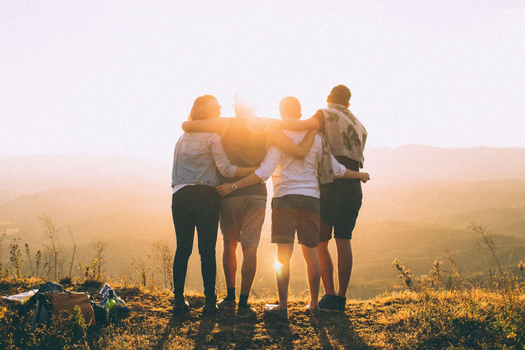 friends on a hike looking at the sunset