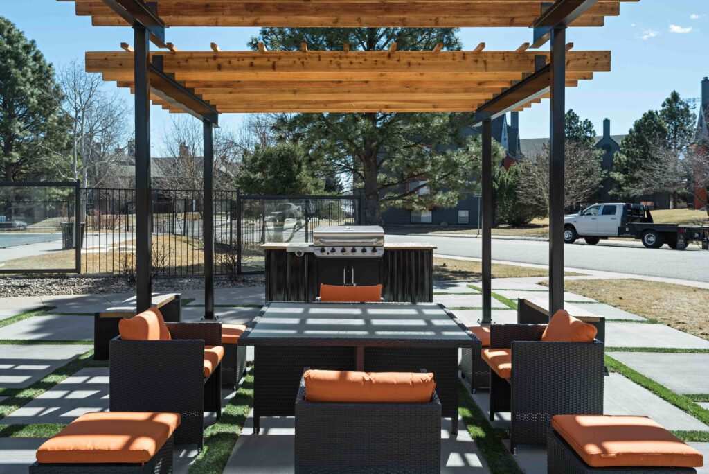 shaded outdoor grilling station and seating area